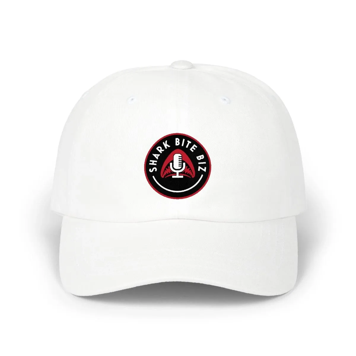 Shark Bite Biz Cap — white baseball cap with the official Shark Bite Biz circular shark-jaws patch logo